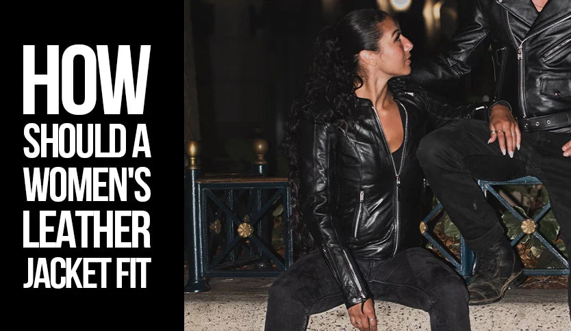 Woman wearing a black leather jacket sitting outdoors - Best Leather NY style guide on how a women’s leather jacket should fit