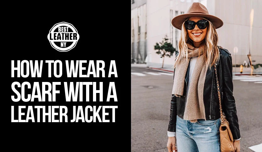 Woman wearing a black leather jacket styled with a beige scarf, wide-brim hat, and sunglasses, showcasing how to wear a scarf with a leather jacket.
